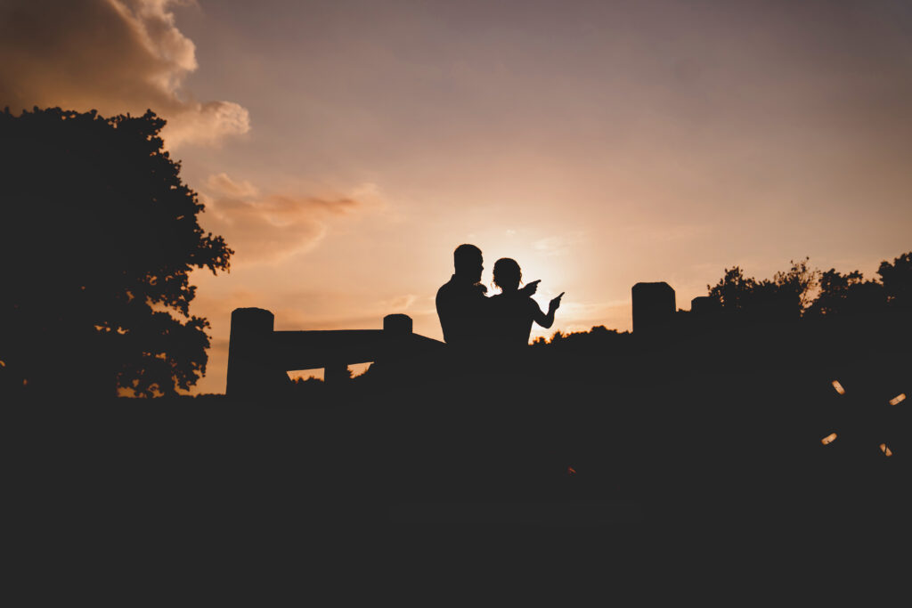 A silhouette of a couple at sunset.